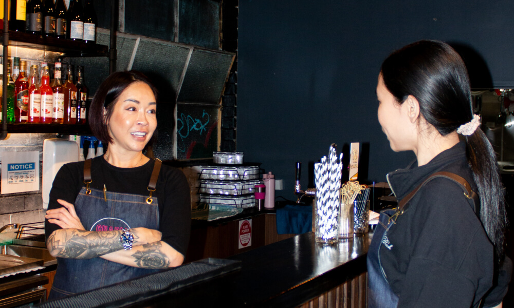 Happy staff interact at the bar