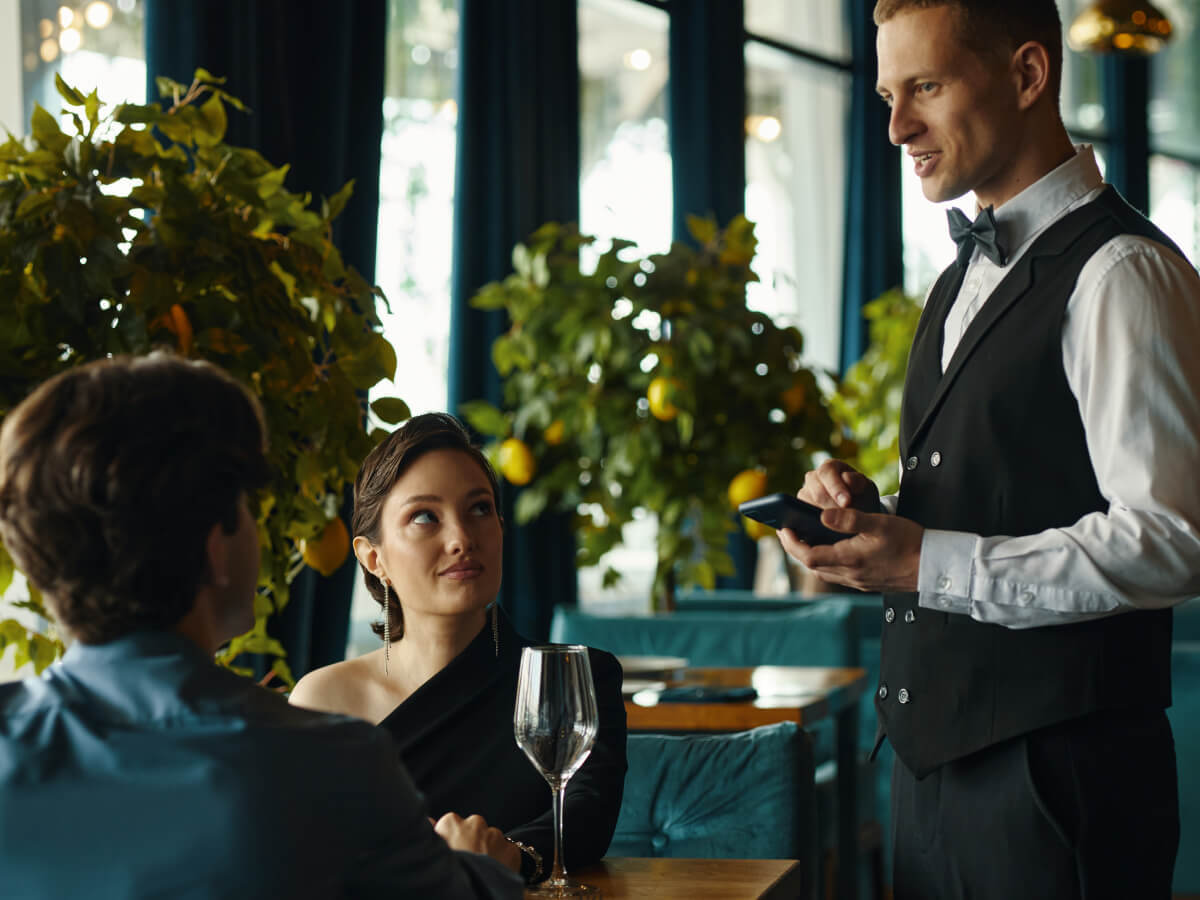 Waiter taking order at a full service restaurant