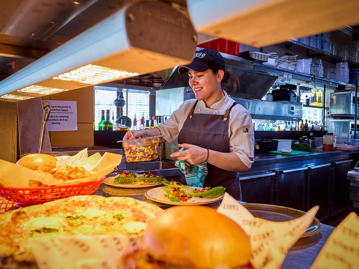 Kitchen staff preparing food in a quick service restaurant