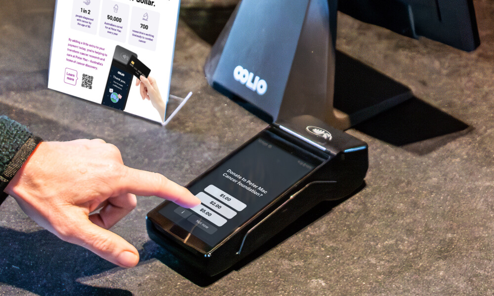 Customer donating via Oolio Giving feature on Oolio pay device
