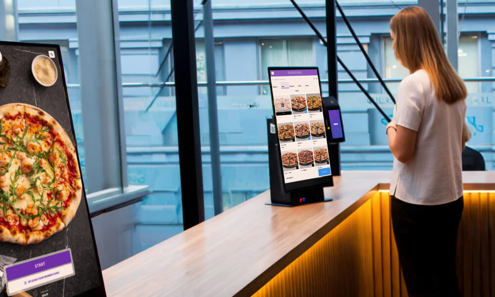 Customer ordering at an Oolio kiosk