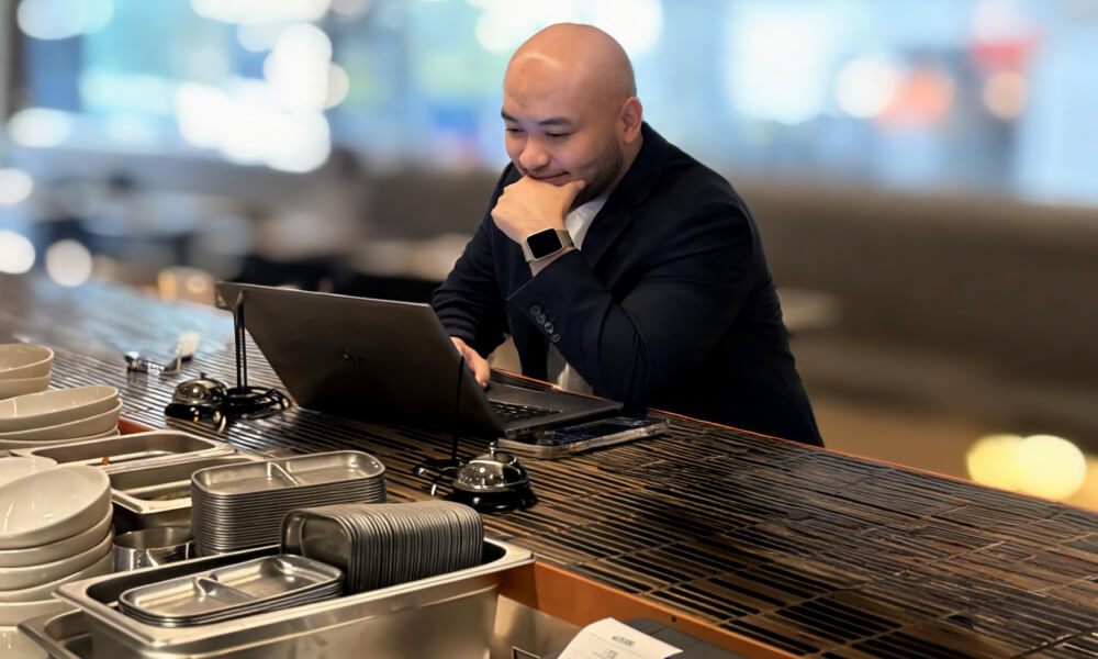 Manager working on laptop
