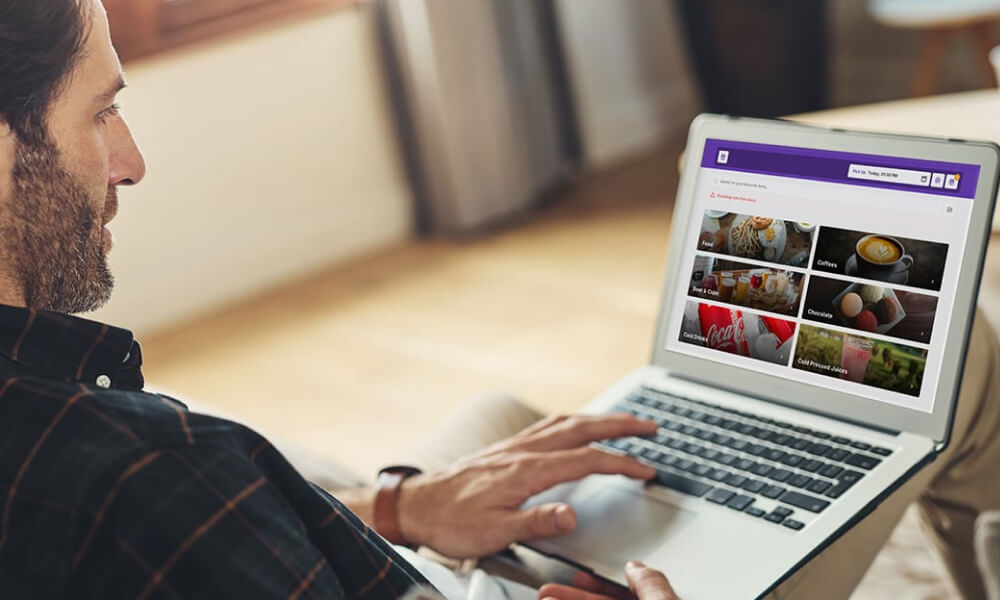 Man ordering online on his laptop