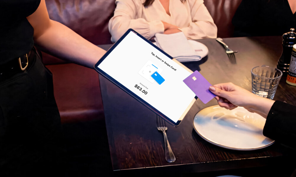 Customer paying by tap on glass