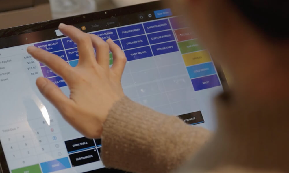 Team member putting through an order on Oolio POS